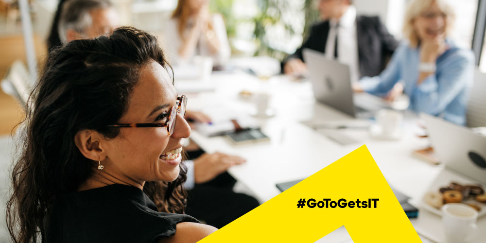 Smiling coworkers collaborating and using soft skills in the workplace