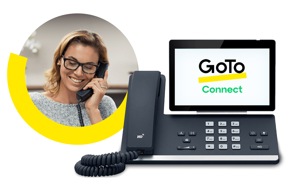 Image of a woman dialing an international number using her GoTo Connect desk phone