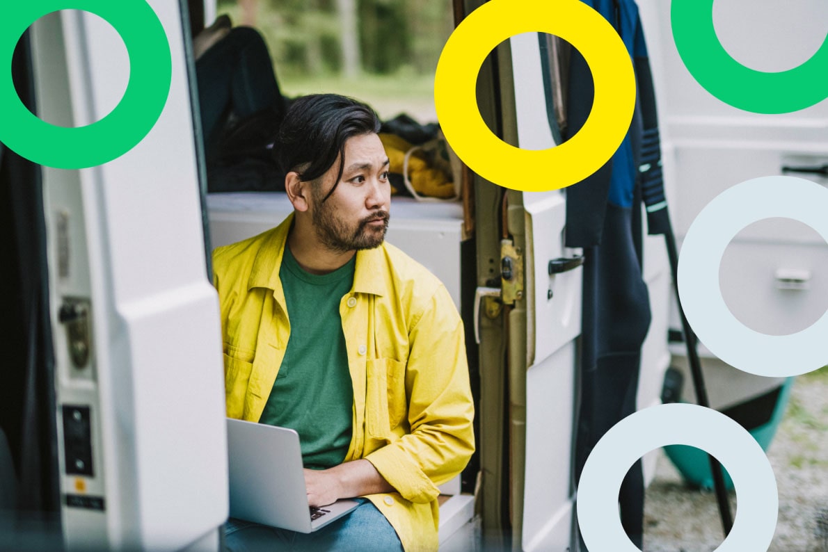An employee using remote collaboration tools with his laptop while on the road.